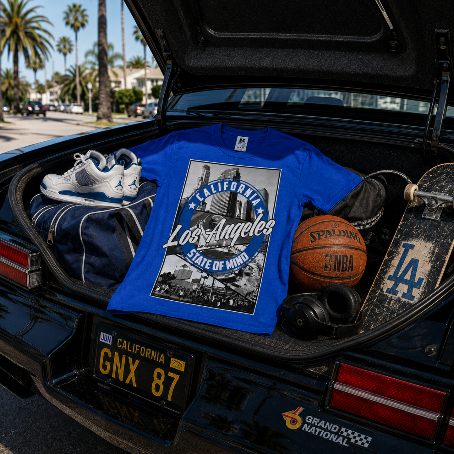 Los Angeles State of Mind blue graphic T-shirt displayed with a custom lowrider, pairing LA baseball culture with unmistakable Southern California street style.