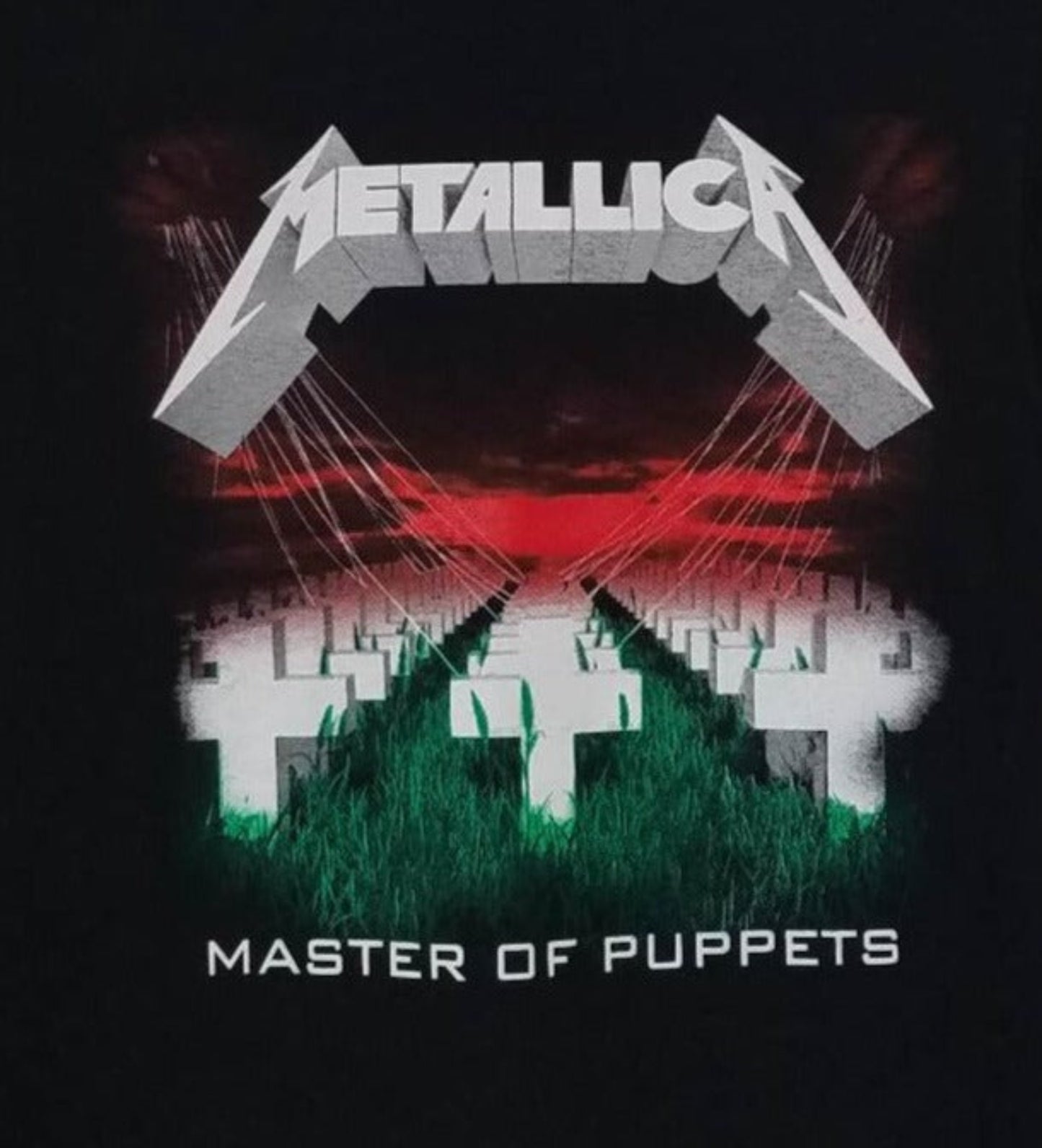 Front view of Metallica Master of Puppets graphic T-shirt featuring crosses field and red sky album artwork on black tee