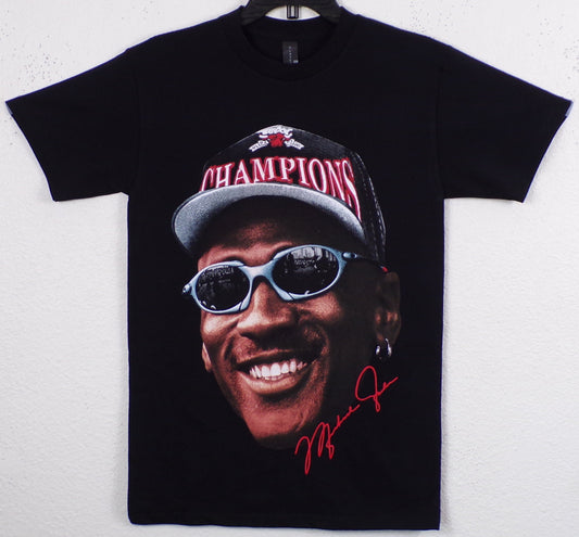 Black Michael Jordan “Champions” t-shirt with bold silkscreen print of MJ in cap and shades. Soft 100% cotton, unisex fit, Small–3XL.