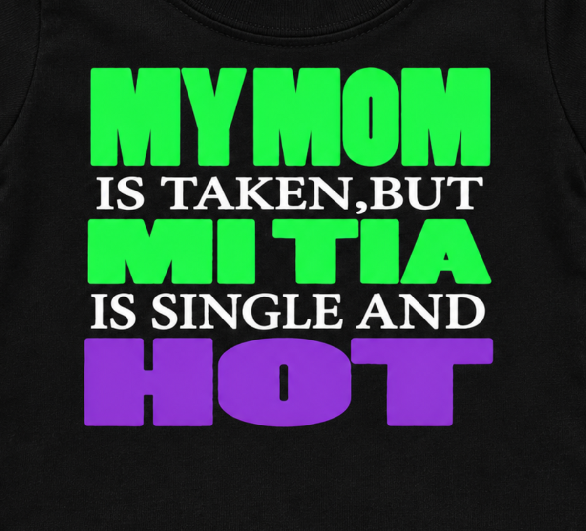 Close-up of the My Mom Is Taken, But Mi Tia Is Single and Hot infant shirt design with bold green, white, and purple lettering.