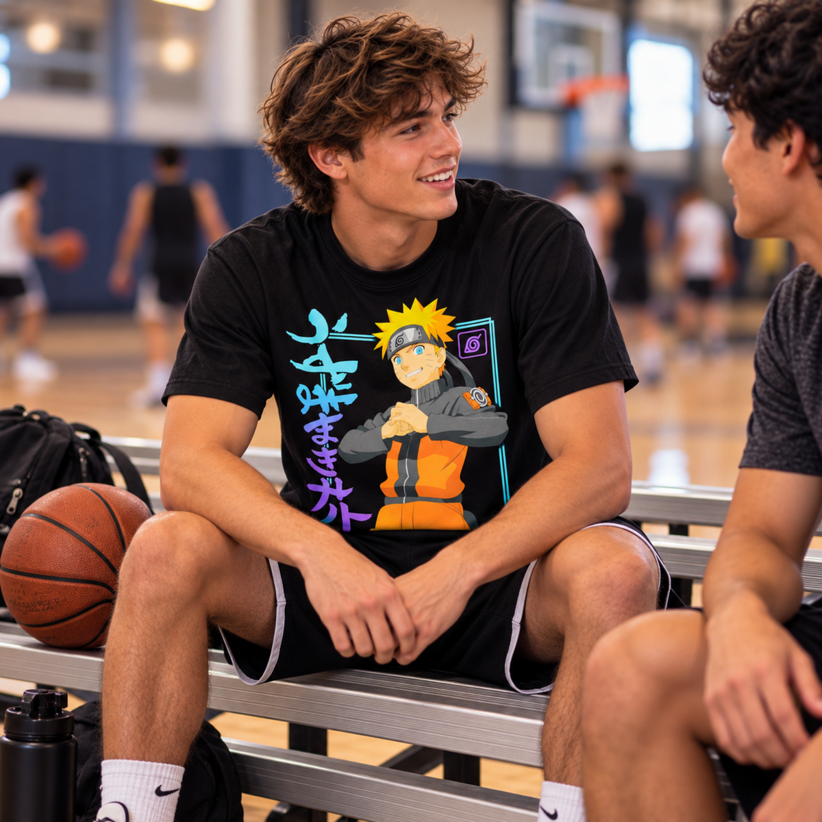 Man wearing the Naruto Uzumaki Ninja Hand Sign black T-shirt while seated on basketball bleachers, featuring Naruto in his Shippuden outfit.
