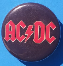 Load image into Gallery viewer, New AC/DC Button Set Of 7 Fashion Buttons Are 1.25&quot; Inches In Size. Set Includes- 1. AC/DC Back In Black 2. AC/DC Brown Cannon 3. AC/DC Hells Bells 4. AC/DC Red Letter Logo On Black 5. AC/DC Red Letters With Face 6. AC/DC Stiff Upper Lip 7. AC/DC Who Made Who

