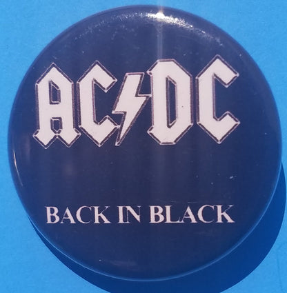 New AC/DC Button Set Of 7 Fashion Buttons Are 1.25" Inches In Size. Set Includes- 1. AC/DC Back In Black 2. AC/DC Brown Cannon 3. AC/DC Hells Bells 4. AC/DC Red Letter Logo On Black 5. AC/DC Red Letters With Face 6. AC/DC Stiff Upper Lip 7. AC/DC Who Made Who
