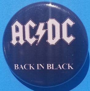 New AC/DC Button Set Of 7 Fashion Buttons Are 1.25" Inches In Size. Set Includes- 1. AC/DC Back In Black 2. AC/DC Brown Cannon 3. AC/DC Hells Bells 4. AC/DC Red Letter Logo On Black 5. AC/DC Red Letters With Face 6. AC/DC Stiff Upper Lip 7. AC/DC Who Made Who