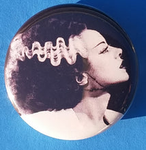 Load image into Gallery viewer, new bride of frankenstein button set of 7 fashion buttons are 1.25 inches in size Set Includes Bride of Frankenstein Bout To Kiss Bride of Frankenstein Couple In Heart Bride of Frankenstein Couple Sharing A Drink Bride of Frankenstein Front View Bride of Frankenstein Hands Over Breast Bride of Frankenstein Side View Frankenstein With Wrench tv movie horror
