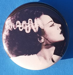 new bride of frankenstein button set of 7 fashion buttons are 1.25 inches in size Set Includes Bride of Frankenstein Bout To Kiss Bride of Frankenstein Couple In Heart Bride of Frankenstein Couple Sharing A Drink Bride of Frankenstein Front View Bride of Frankenstein Hands Over Breast Bride of Frankenstein Side View Frankenstein With Wrench tv movie horror