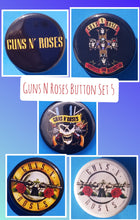 Load image into Gallery viewer, new guns n roses button set of 5 fashion buttons are 1.25 inches in size Set Includes Guns N Roses Appetite For Destruction Guns N Roses Double Gun On Black Guns N Roses Double Gun On White Guns N Roses Slash Skull With Double Gun Guns N Roses Yellow Logo On Black hard rock music pinback
