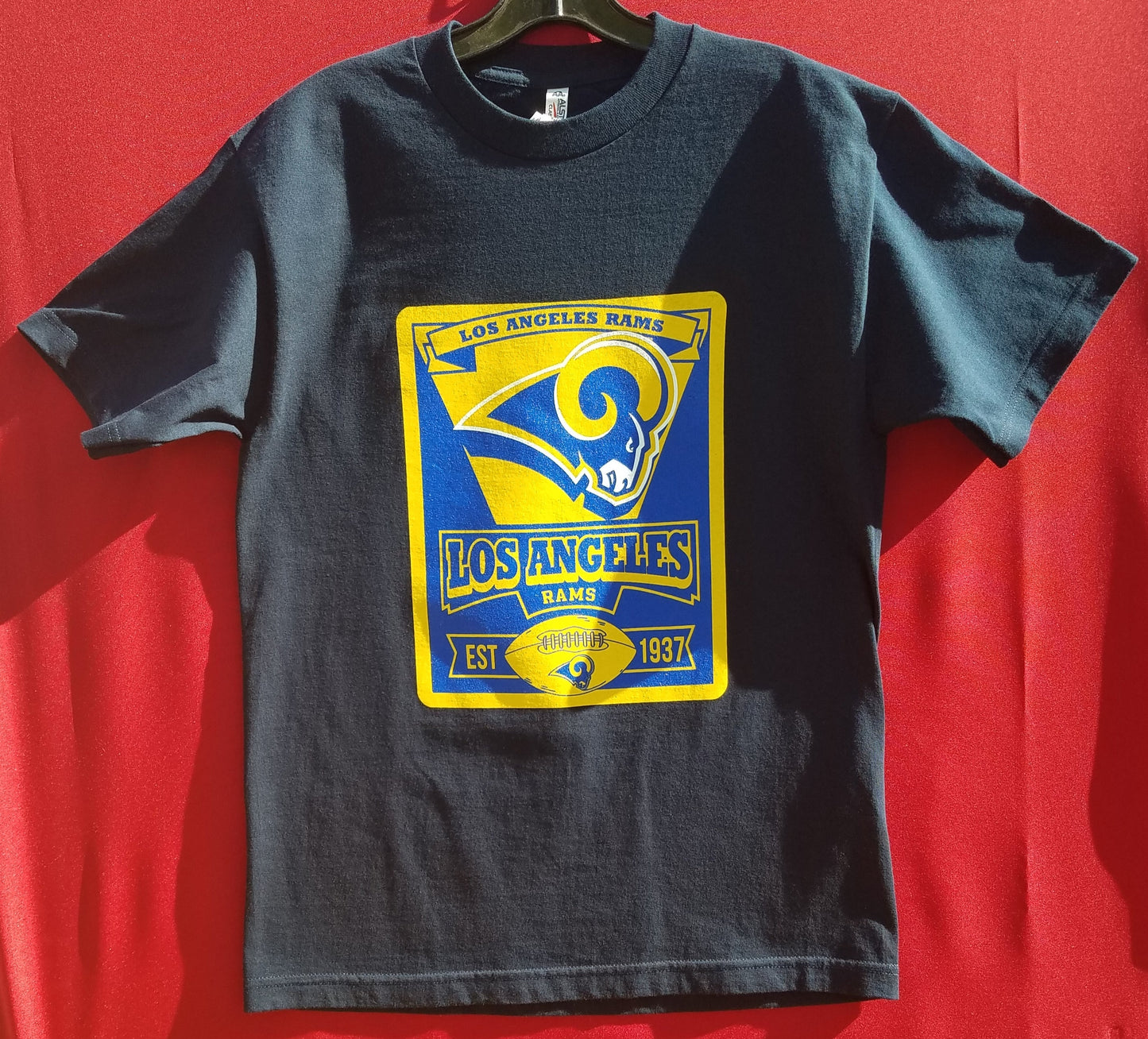 new los angeles rams flag mens silkscreen t-shirt image is on the front of the shirt available from small-3xl sports football rams apparel adult shirts tops