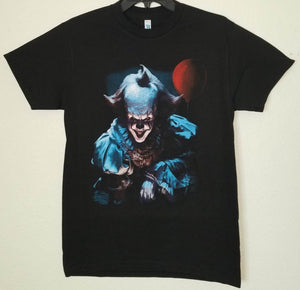 Pennywise IT Clown Unisex Silkscreen T-Shirt featuring a bold graphic of Pennywise from the horror movie IT. Available in sizes Small-2XL.