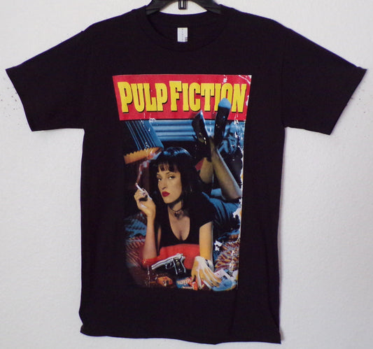 Black unisex “Pulp Fiction – Movie Cover” T-shirt featuring Mia Wallace movie poster artwork with bold red and yellow lettering, sizes Small–3XL.