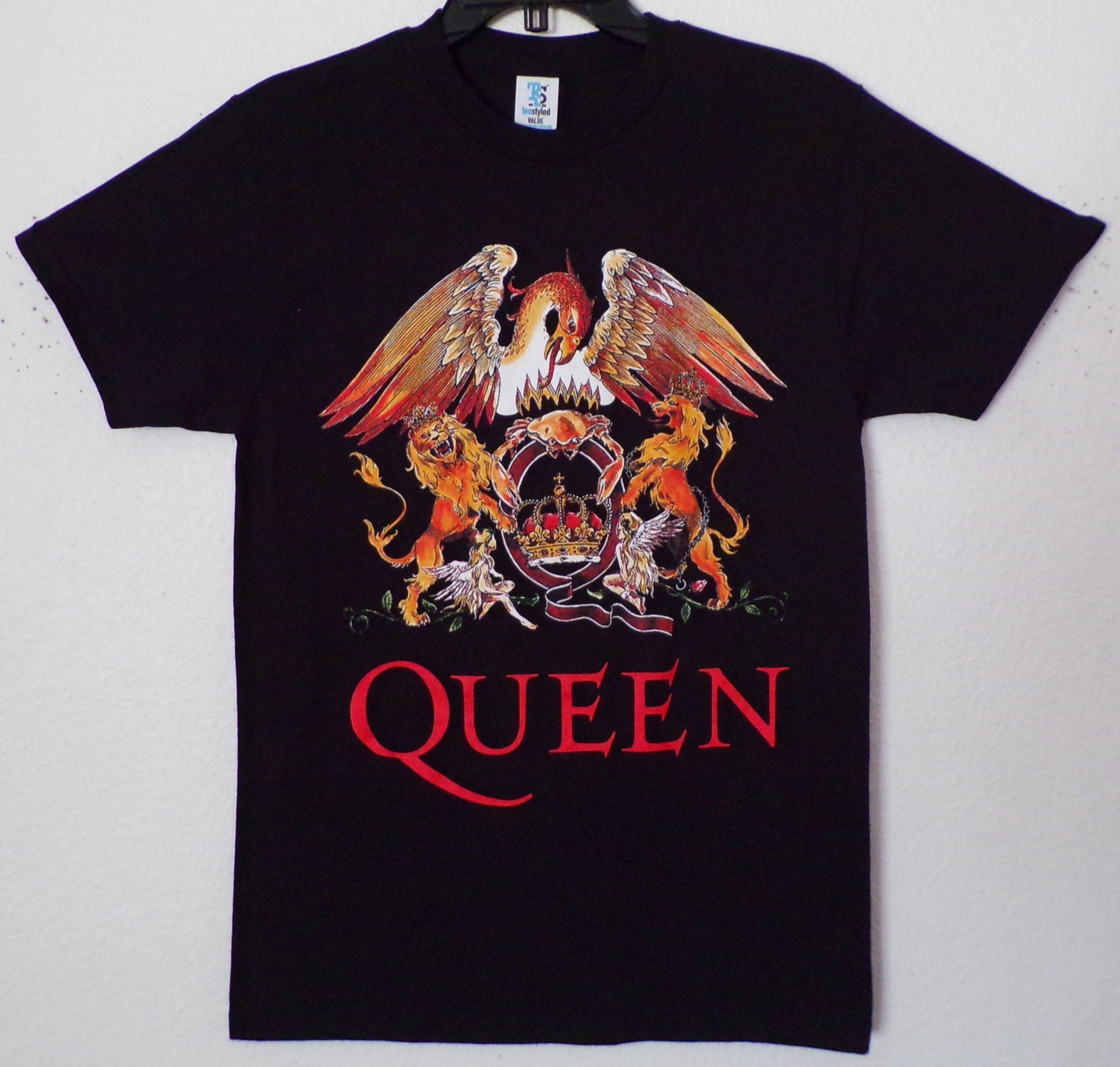 Front view of Queen crest graphic T-shirt featuring lion, phoenix, and crown emblem on black tee