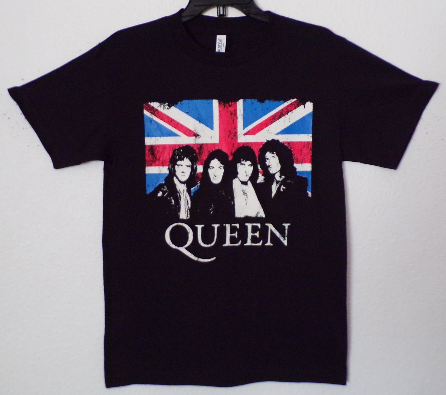 Front view of Queen Union Jack graphic T-shirt featuring band portrait over British flag on black tee