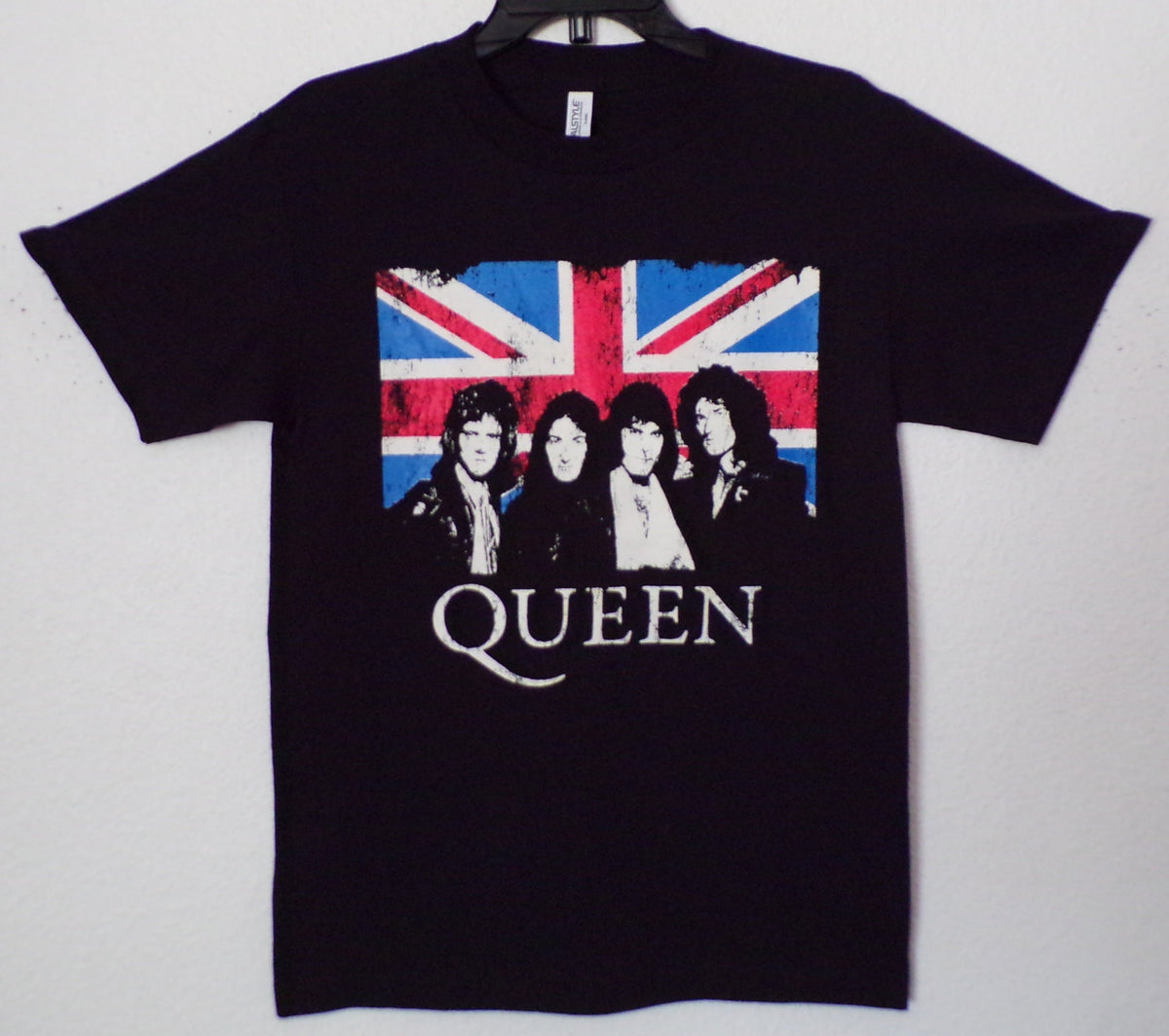 Front view of Queen Union Jack graphic T-shirt featuring band portrait over British flag on black tee