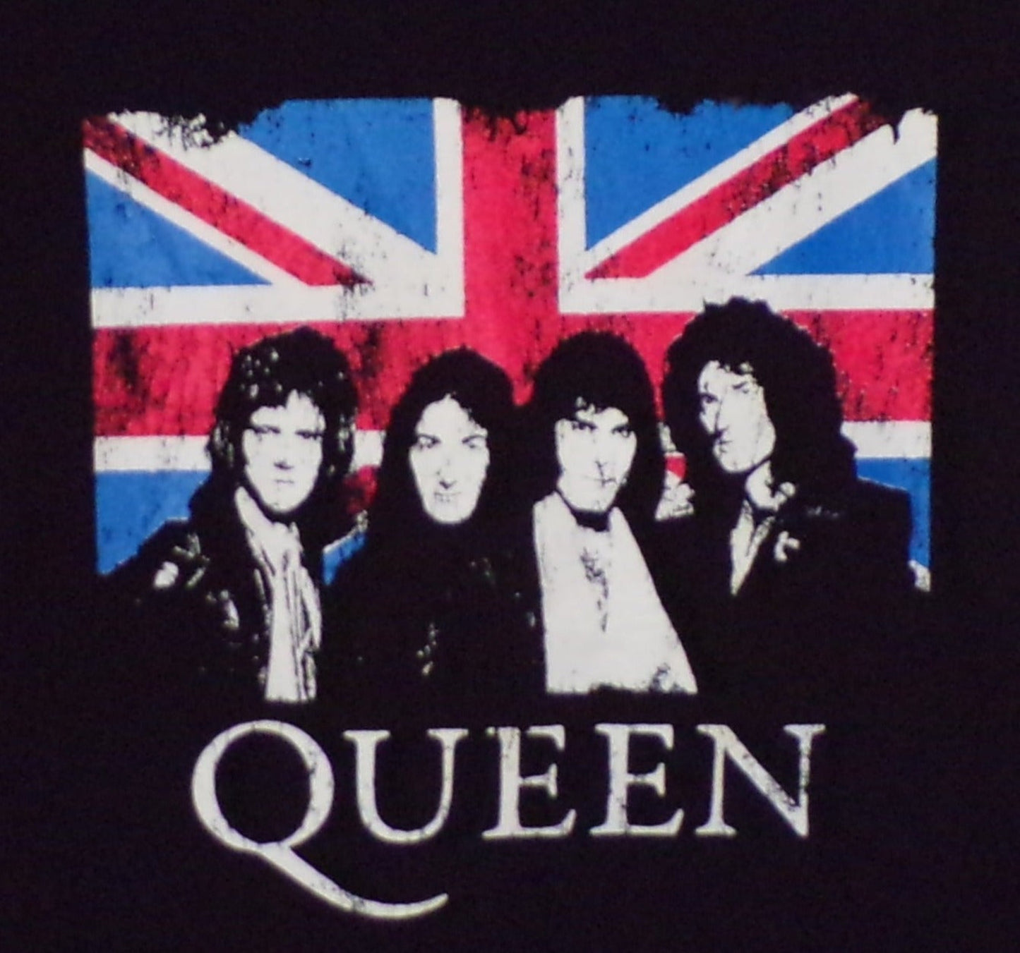 Front view of Queen Union Jack graphic T-shirt featuring band portrait over British flag on black tee