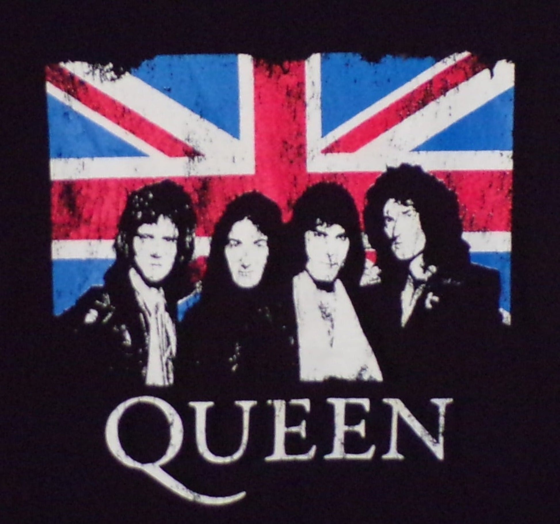 Front view of Queen Union Jack graphic T-shirt featuring band portrait over British flag on black tee