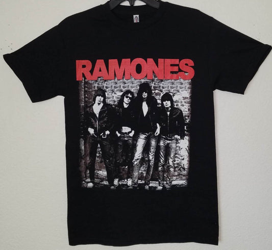 Front view of Ramones 1976 debut album band graphic T-shirt featuring classic black-and-white punk photo on black cotton tee