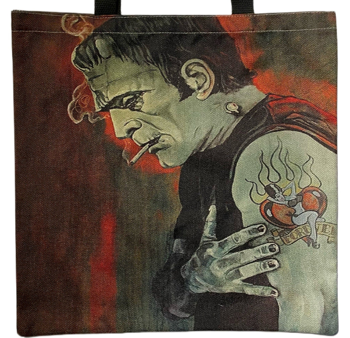 Close-up of Rockabilly Frankenstein artwork featuring the Monster's pale green face, cigarette, slicked-back hair, sleeveless shirt, and heart tattoo against a distressed dark red background.