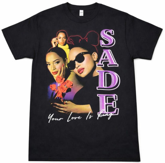Black “Sade – Your Love Is King” unisex T-shirt featuring a multi-image collage of Sade with purple and red tones, Small–3XL.