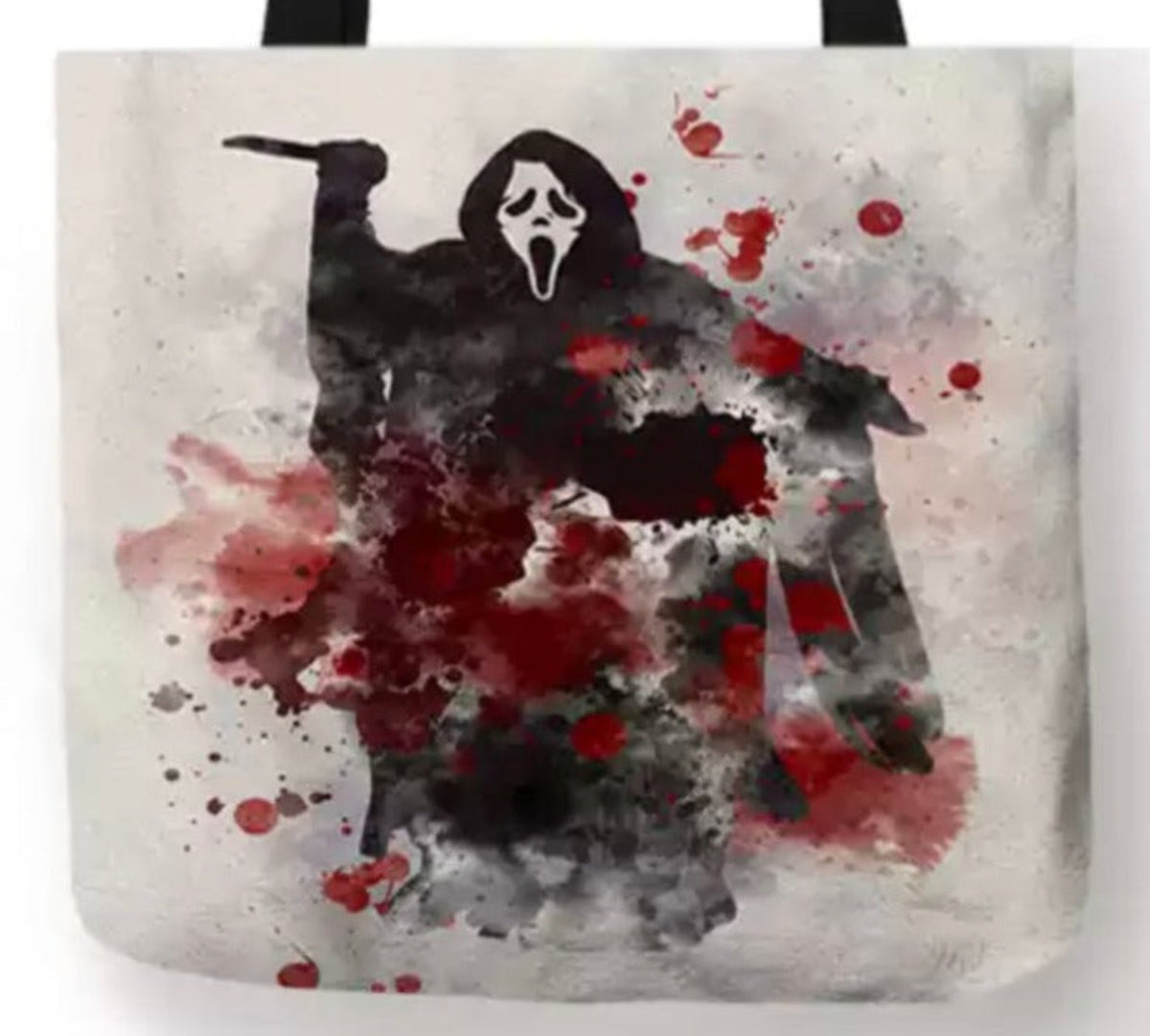 Close-up of Scream Ghostface tote bag artwork featuring the white ghost mask, black hooded robe, knife, red blood splatters, and smoky gray background.