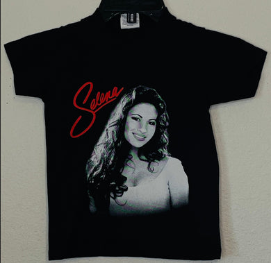 Youth T-shirt featuring the 'Selena Red Script' design, showcasing a bold red script in tribute to Selena. Available in XS-XL.