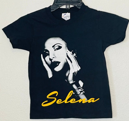 "Selena Yellow Script Youth T-Shirt" – A vibrant yellow script of Selena’s iconic name on a soft and comfortable. Available in XS-XL