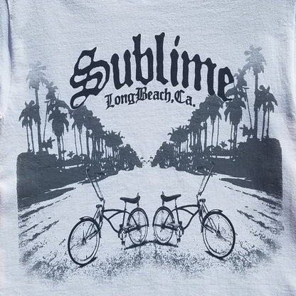 Front view of Sublime Long Beach Bikes graphic T-shirt featuring palm trees and lowrider bicycles printed in authentic silkscreen on white cotton tee