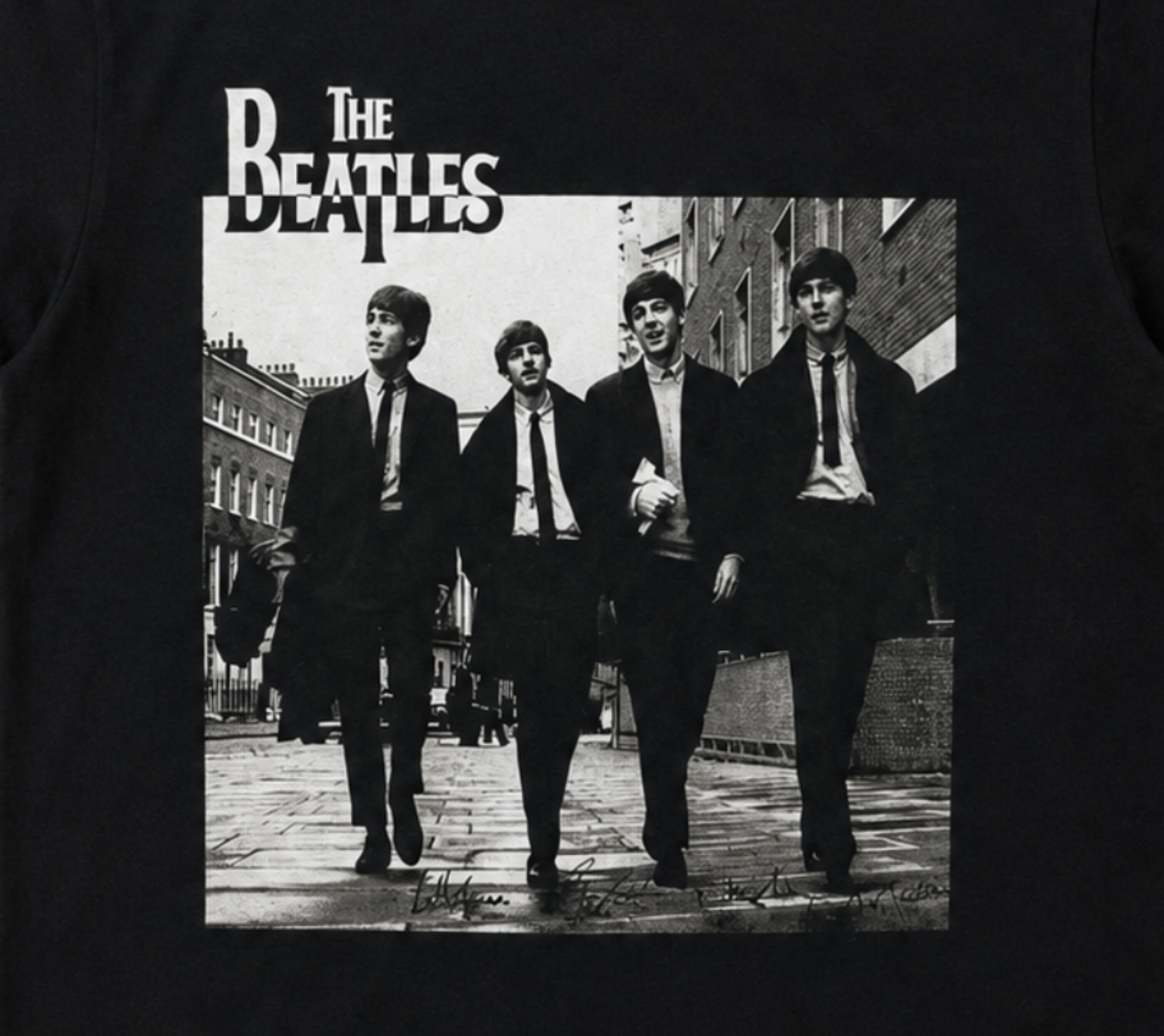 The Beatles London street portrait graphic T-shirt showing band walking in Soho 1963 black and white image unisex sizes S–3XL