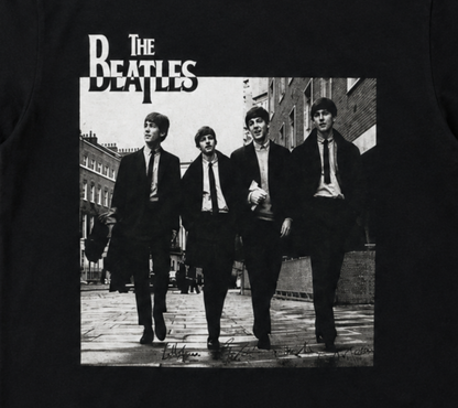 The Beatles London street portrait graphic T-shirt showing band walking in Soho 1963 black and white image unisex sizes S–3XL