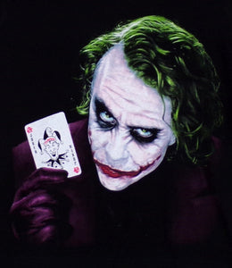 The Dark Knight Joker Youth Silkscreen T-Shirt featuring an intense, high-quality print of the Joker from The Dark Knight. Made from 100% combed ring-spun cotton, unisex fit. Available in XS-XL