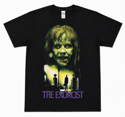 The Exorcist black T-shirt featuring possessed Regan MacNeil above Father Merrin beneath the streetlight—a must-have for fans of the 1973 horror classic.