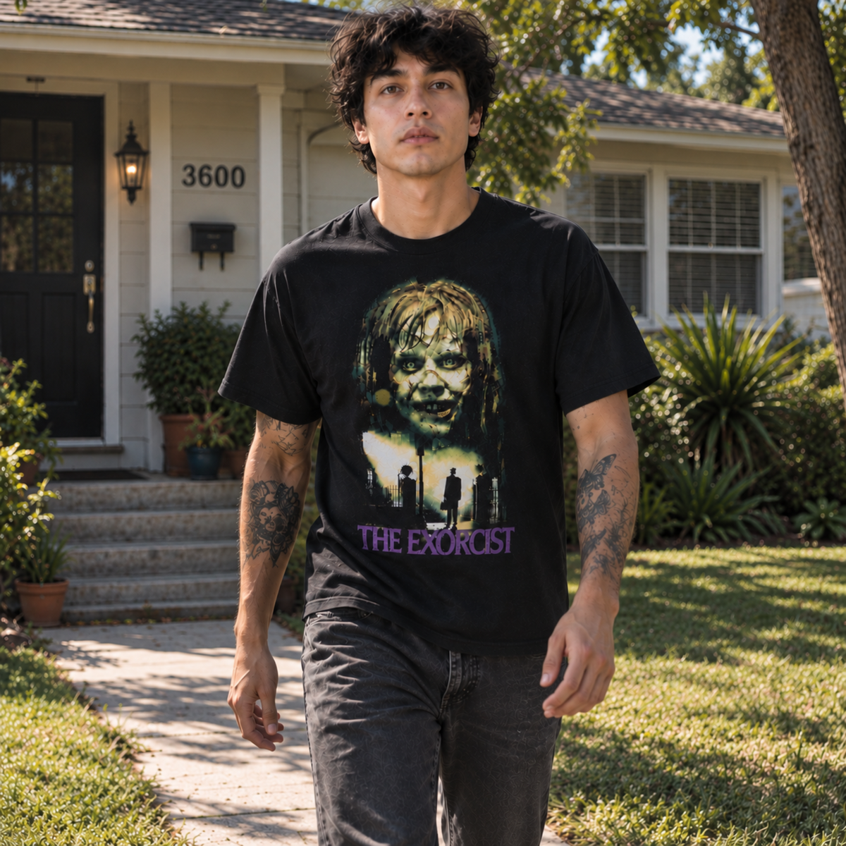 Man wearing The Exorcist black T-shirt outdoors, featuring the possessed Regan MacNeil design—a standout choice for collectors of classic horror shirts.
