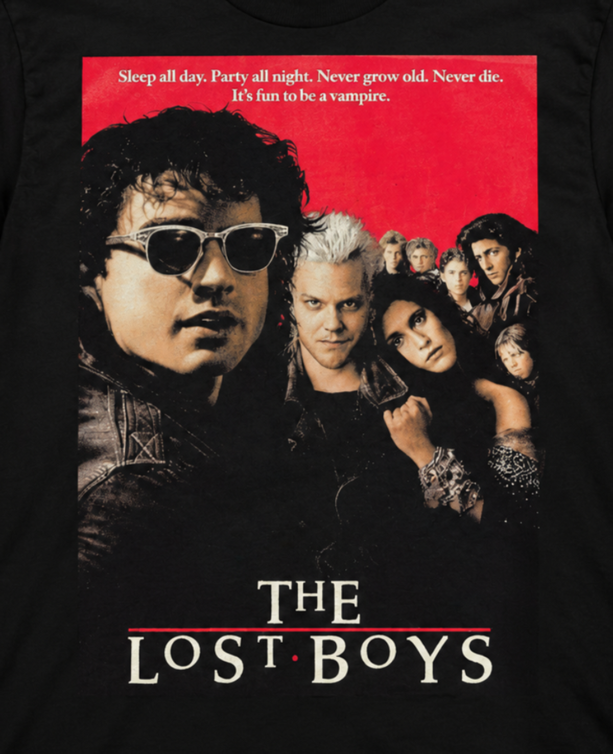 Close-up of The Lost Boys black graphic T-shirt featuring the original 1987 movie-cover artwork with the cast portraits and recognizable film title.