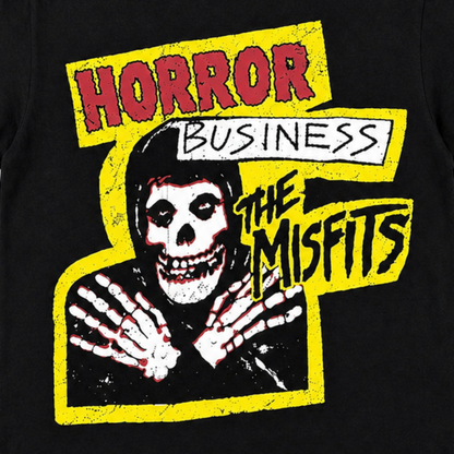 Close-up of The Misfits Horror Business T-shirt featuring the Crimson Ghost Fiend, skeletal hands, distressed yellow artwork and Horror Business lettering.