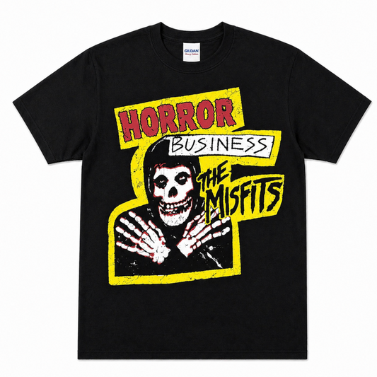 Black The Misfits Horror Business graphic T-shirt featuring the hooded Crimson Ghost Fiend, skeletal hands, yellow framing and classic Misfits lettering.