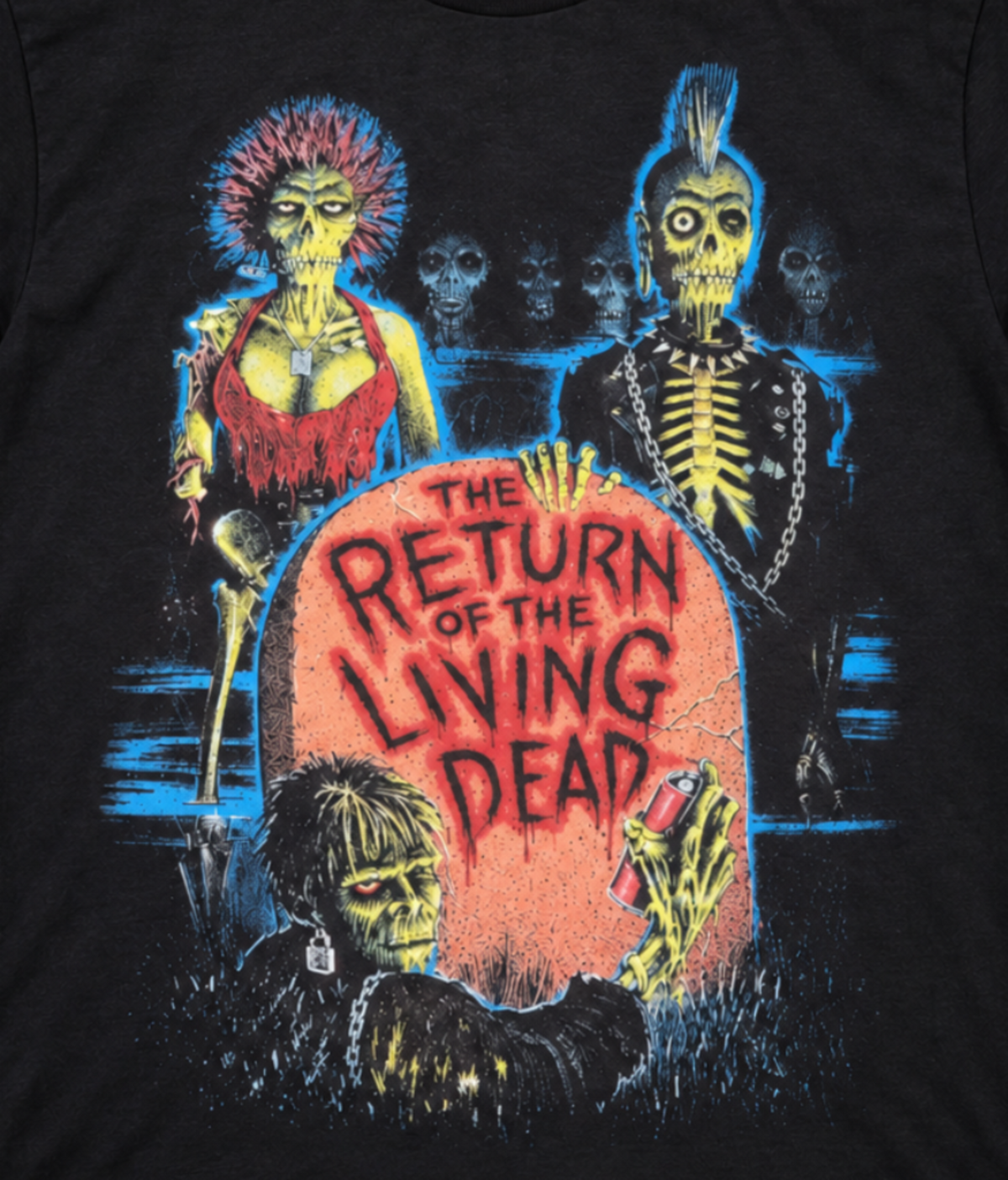 Close-up of The Return of the Living Dead 1985 T-shirt showing decaying zombies surrounding the colorful tombstone movie title artwork.