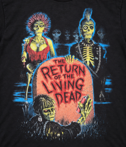 Close-up of The Return of the Living Dead 1985 T-shirt showing decaying zombies surrounding the colorful tombstone movie title artwork.