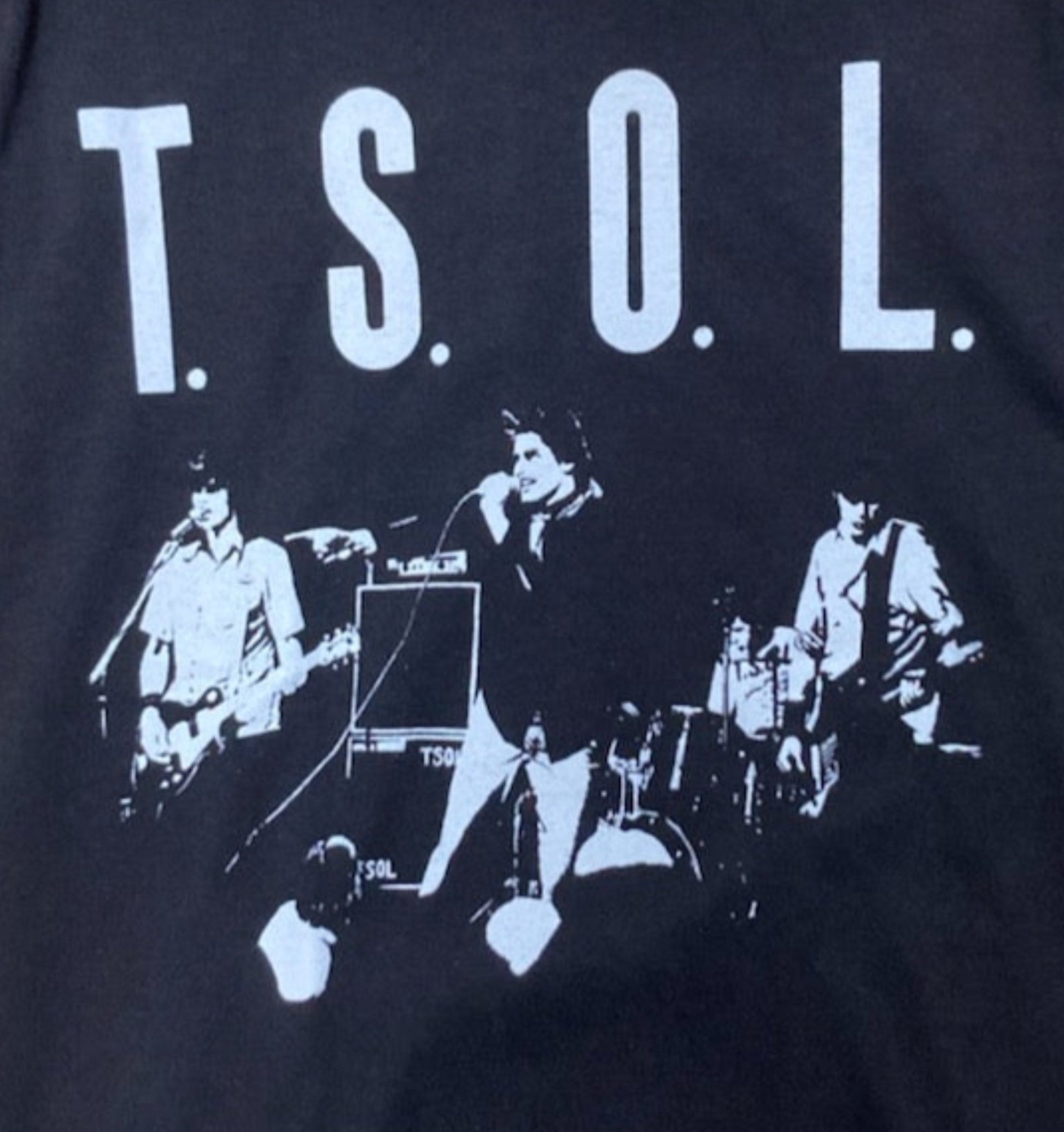 Black “T.S.O.L. – True Sounds of Liberty” T-shirt featuring the band performing live with bold white text above the image.