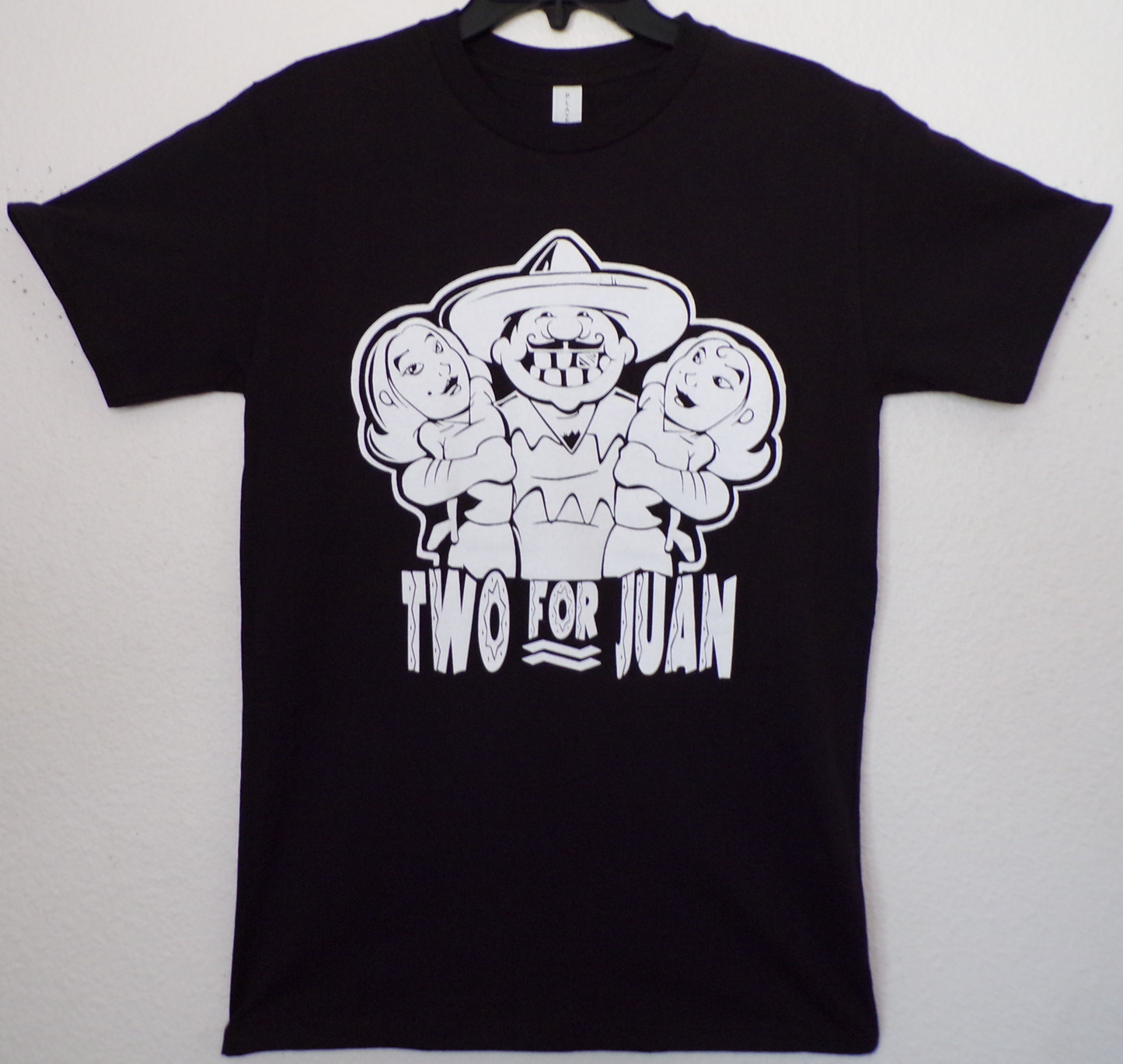Two For Juan funny graphic T-shirt with sombrero character and text design unisex apparel available in sizes S–2XL