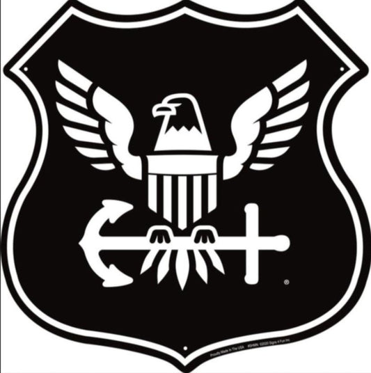 United States Navy embossed aluminum shield sign featuring an eagle, shield, and anchor design, 12 inch diameter.
