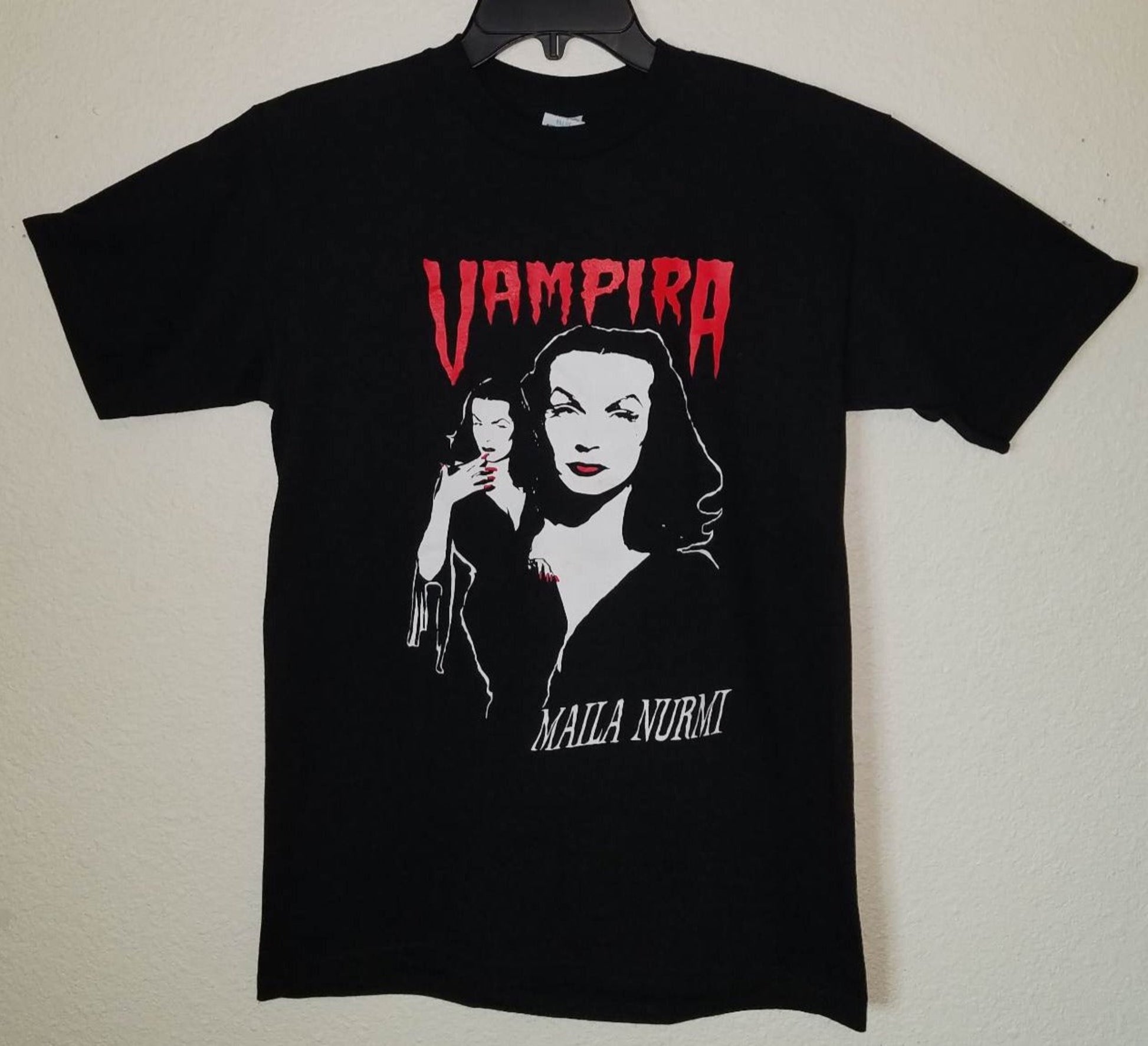 Vampira Maila Nurmi gothic horror graphic T-shirt featuring classic black and red design on unisex shirt S–3XL