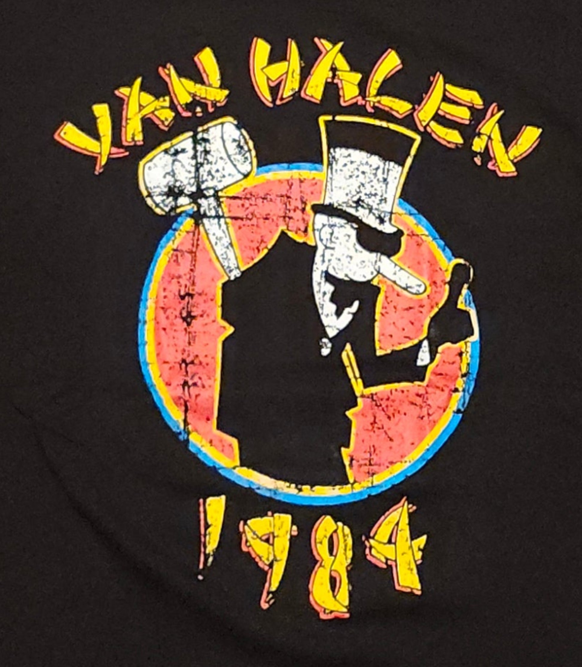 Black “Van Halen 1984” T-shirt featuring colorful distressed album artwork with vintage-inspired graphic design.
