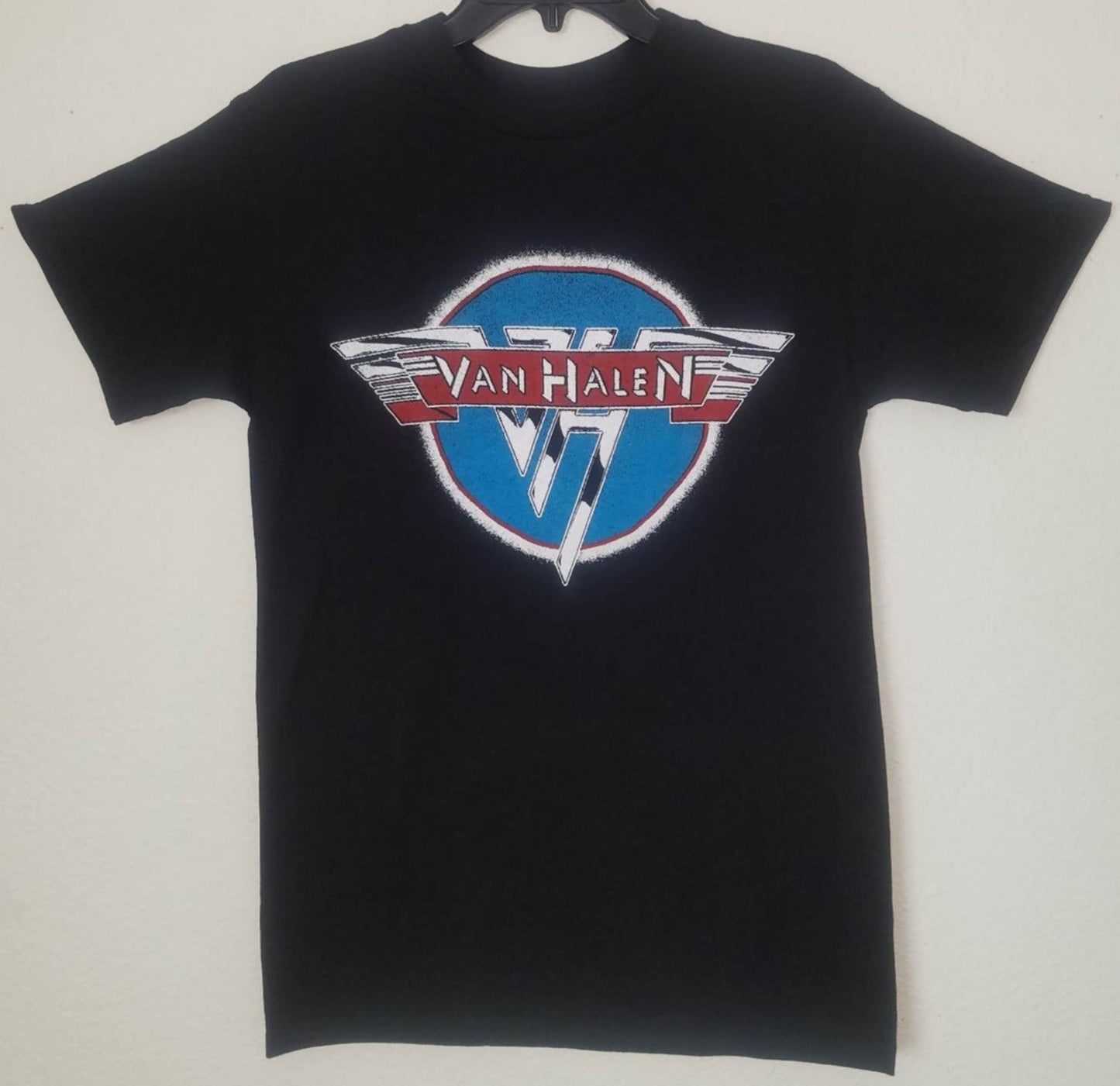 Black unisex “Van Halen” T-shirt featuring the band’s classic red, white, and blue logo design — rock music apparel for men and women, sizes Small–2XL.