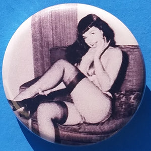 new bettie page button set of 3 fashion buttons are 1.25 inches in size Set Includes Bettie Page Color Picture Bettie Page Holding Whip Bettie Page Sitting With Leg Up