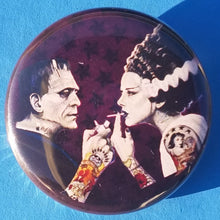 Load image into Gallery viewer, new bride of frankenstein button set of 7 fashion buttons are 1.25 inches in size Set Includes Bride of Frankenstein Bout To Kiss Bride of Frankenstein Couple In Heart Bride of Frankenstein Couple Sharing A Drink Bride of Frankenstein Front View Bride of Frankenstein Hands Over Breast Bride of Frankenstein Side View Frankenstein With Wrench tv movie horror
