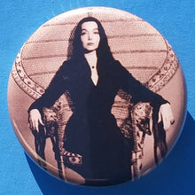 Load image into Gallery viewer, new the addams family button set of 7 fashion buttons are 1.25 inches in size Set Includes Group Picture The Addams Family Logo Morticia Gomez Morticia In A Chair Morticia Up close Uncle Fester Wednesday vintage hollywood movie collection tv pinback

